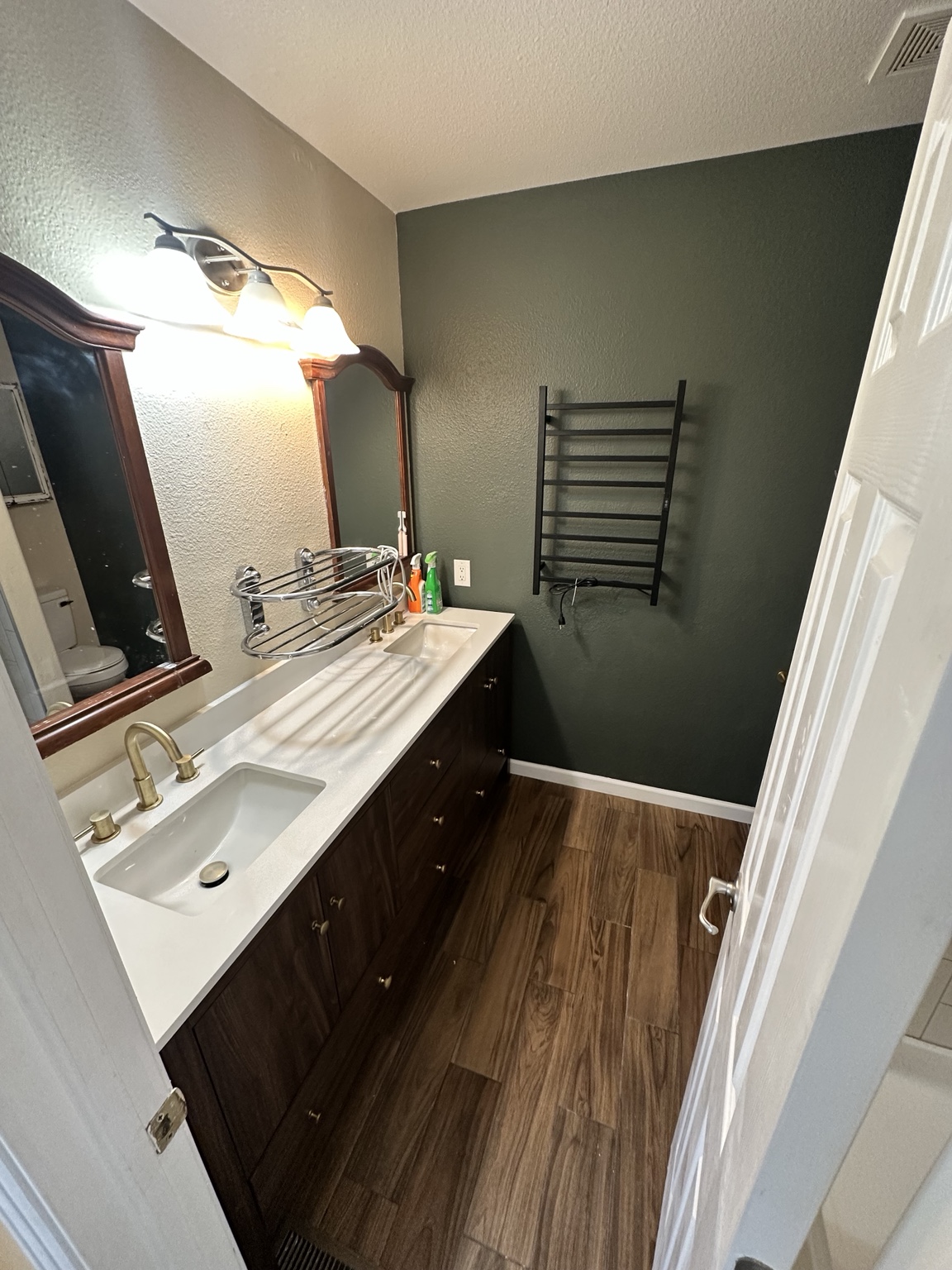 Completed bathroom renovation with new vanity and flooring